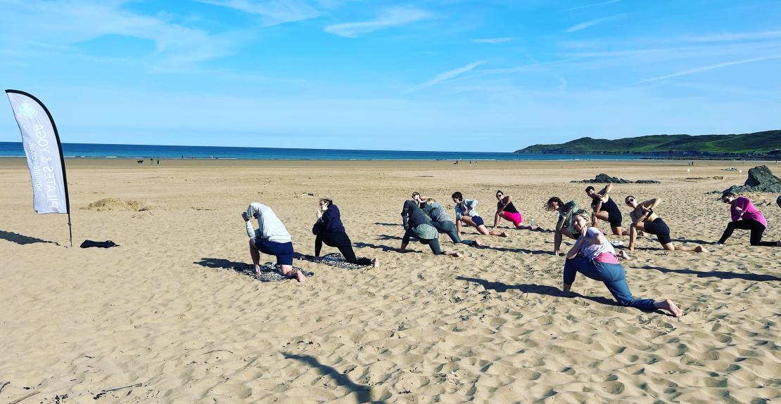 Take a Yoga Class on the Beach During Your Vacation